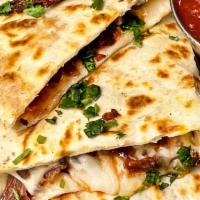 Quesadillas · Vegetarian. Flour tortilla, Chihuahua cheese, guacamole, pico de gallo and crema.