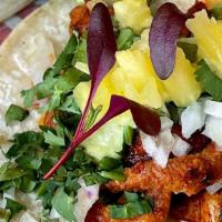 Al Pastor · Marinated seared sliced pork shoulder, fresh pineapple, diced onions, cilantro, and roasted ...