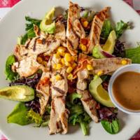 Chicken & Avocado Salad · Grilled chicken breast, sliced avocado, crispy bacon, red onion and corn served over spring ...