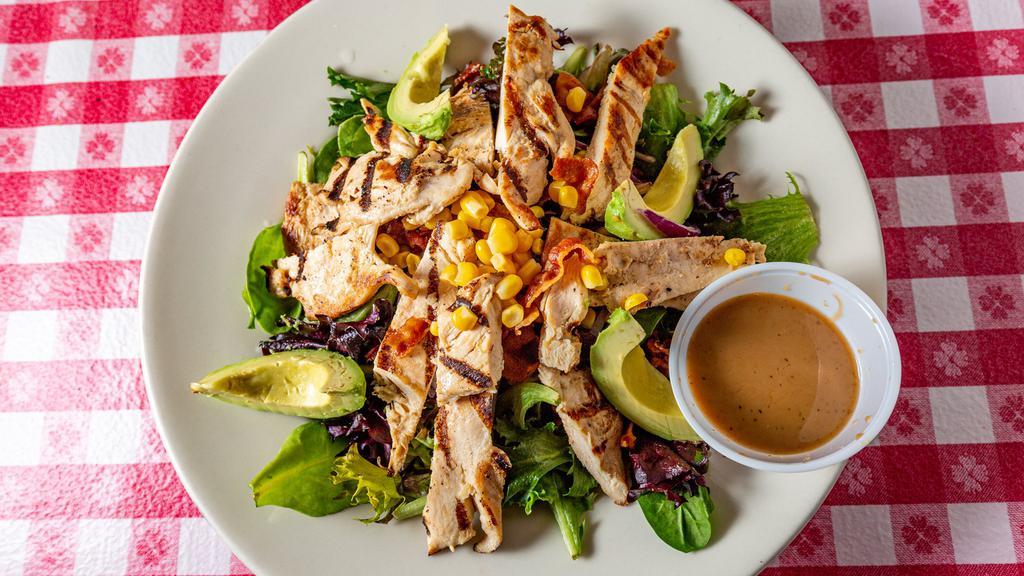Chicken & Avocado Salad · Grilled chicken breast, sliced avocado, crispy bacon, red onion and corn served over spring mix with choice of dressing.