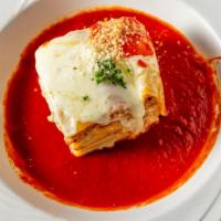 Meat Lasagna · Lasagna topped with classic cheese, tomato sauce, and ground beef.