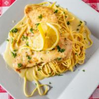 Chicken Francese Catering · Dipped in a light egg batter and sautéed in a white wine and lemon sauce.