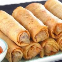 Spring Rolls · Crispy golden fried spring rolls with sweet chilly sauce. Choice of chicken or vegetables.