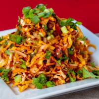 Szhwern Bhel · Crispy wonton noodles tossed with cabbage, scallions, bean, sprouts, onions, cilantro and ch...