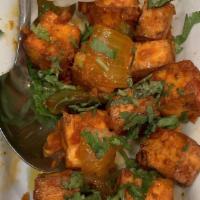 Chili Paneer · Cubes of Cottage cheese with fresh chili and onions in light soy sauce.