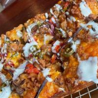 Spicy Roadster (Large) · Crispy fried chicken tossed in buffalo sauce, jalapeños, seasoned diced tomatoes, red onions...