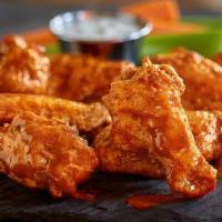 Chicken Wings · Served with your choice of sauce: buffalo, red chili, honey BBQ or plain. Two sizes – regula...