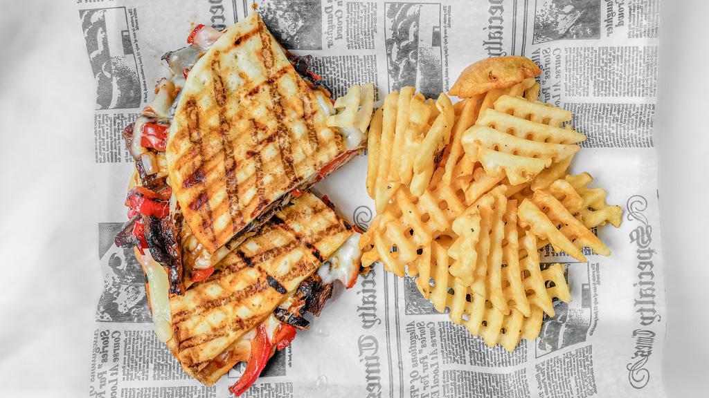 Grilled Skirt Steak Panini · Melted provolone, sautéed peppers, onions and bbq sauce.