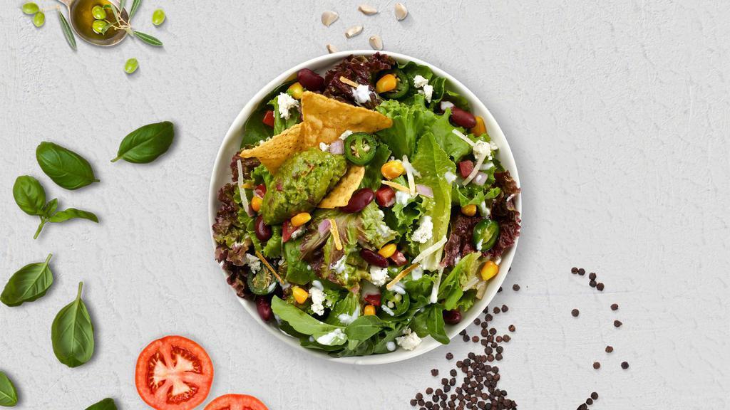 Tic Taco Salad · Romaine lettuce, diced tomatoes, red onion, cheddar cheese, corn, crushed tortilla chips and vegan ground beef topped with our delicious taco salad dressing.