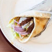 Falafel Wrap · Includes lettuce, tomatoes, pickles, and onions.