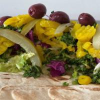 Loaded Veggie Wrap · Comes with home made hummus, lettuce,   seasoned red cabbage, tabbouleh, pickled, cucumbers,...