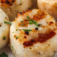 Grilled Scallops · Seasoned scallops, cooked on tawa, servedon a bed of rosemary with tomato chutney.