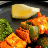 Paneer Tikka · Marinated homemade cottage cheese cubes, skewered & cooked in a tandoor.