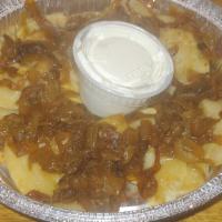 Pierogies  · Pan-fried with carmelized onions and side of sour cream.