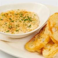 Warm Crab & Artichoke Dip · A Delicious Blend of Crab, Artichokes and Cheese Served Warm