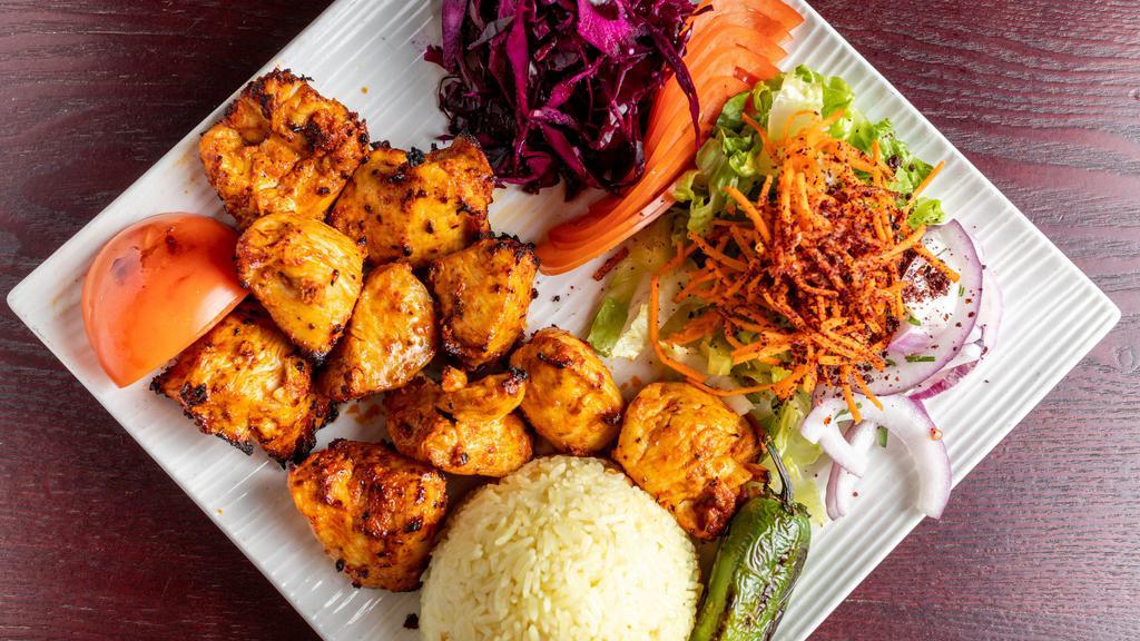 Chicken Shish Kebab · Tender chunks of chicken marinated with chef's own blend of herbs and spices. Served with rice and salad.