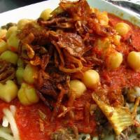 Kushry Dish · Mixed rice, macaroni, and lentils topped with tomato sauce, chickpeas, crispy onions, and ga...
