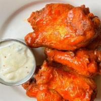 Sweet Wings · Chicken wings tossed in our homemade honey BBQ sauce served with side of gorgonzola cheese d...