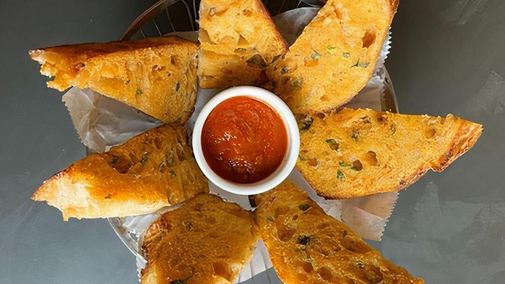 Garlic Bread · Toasted rustic italian bread with garlic parmesan butter, served with marinara sauce