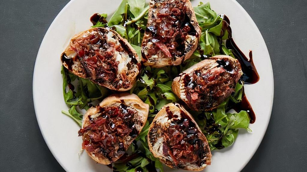 Goat Cheese Prosciutto Crostini · Grilled ciabatta bread with creamy goat cheese, caramelized red onion, crispy prosciutto chips and sweet balsamic glaze