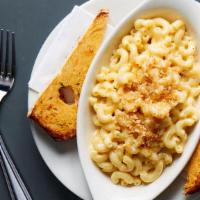 Mac & Cheese · Elbow macaroni bathed in our blended three cheese sauce of white cheddar, mozzarella and par...