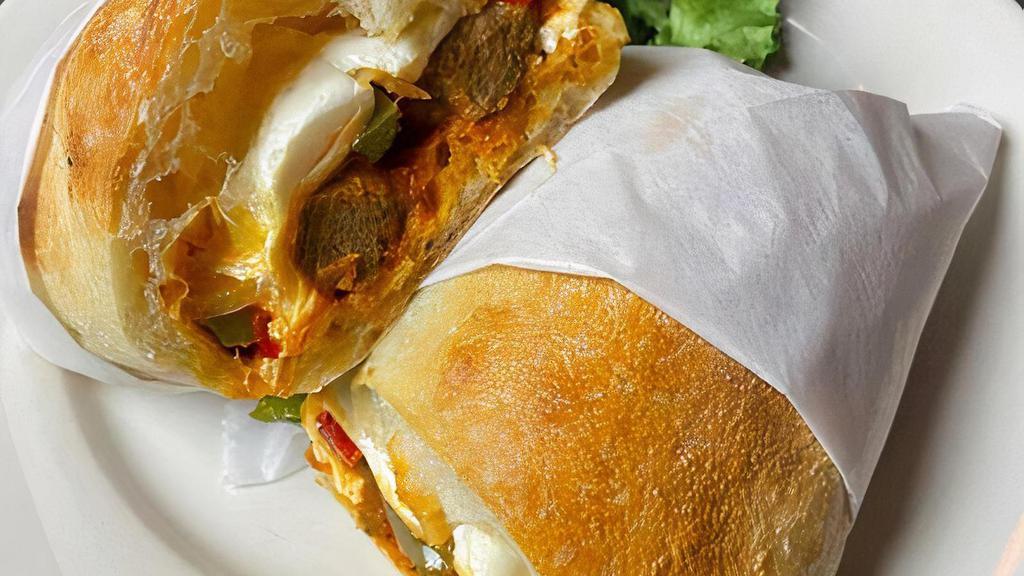 Meatball Sandwich · Homemade meatballs, fresh mozzarella, sautéed green bell peppers and onions, marinara sauce on hero bread PLEASE NOTE: Peppers and Onions are cooked together you can not leave off one without leaving off the other.
