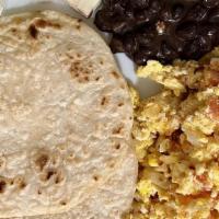 Desayuno Especial (Special Breakfast) · Huevos revueltos con tomato y cebolla, frijoles queso crema y tortilla. / Scrambled eggs wit...