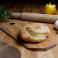 Tiropita Pi · Hand-stretched phyllo dough stuffed with imported feta cheese and Greek herbs.