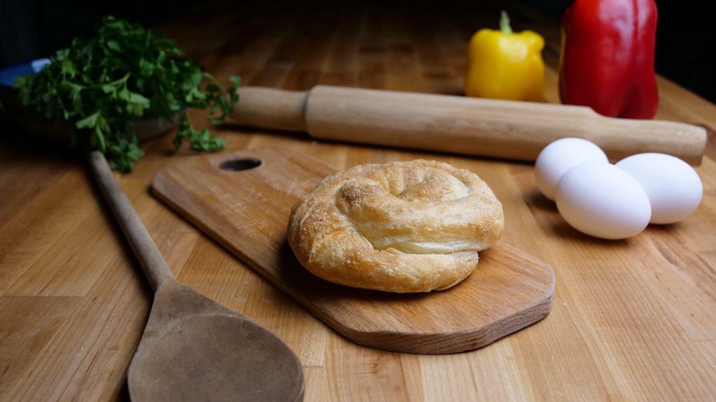 Tiropita Pi · Hand-stretched phyllo dough stuffed with imported feta cheese and Greek herbs.