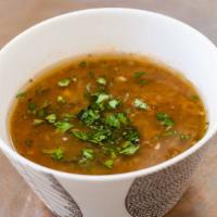 Lentil Soup · Flakes with sauteed onions, carrots and celery in a light tomato and lentil broth. Served wi...