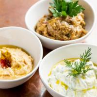 Dip Trio · A combination of each of our signature dips. Served with baked pita chips.