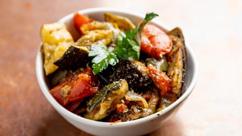 Briam Small · A Greek version of ratatouille. Includes baked eggplant, zucchini, green bell peppers, and fresh garden herbs in a light tomato suace.