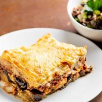 Moussaka Pi · Baked eggplant, ground beef and potatoes in a caramelized tomato sauce, topped with a light ...