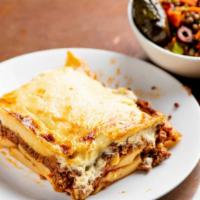 Pastitsio Pi · Penne, ground beef in a light caramelized tomato sauce, topped with a light béchamel sauce a...