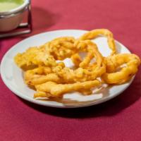Onion Pakoda · Slice Onion deep fried with flour and Indian spices