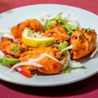 Chicken Tikka · Tender boneless pieces of chicken subtly flavored with spices and barbecued on a skewer in o...