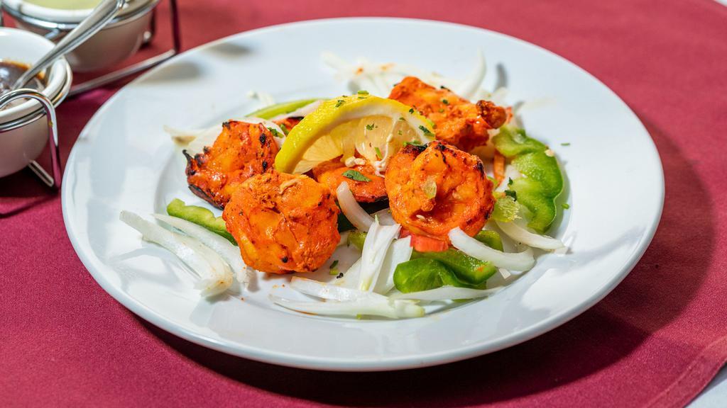 Shrimp Tandoori · Fresh shrimp lightly seasoned and slowly broiled over charcoal in our tandoor.
