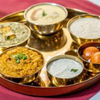 Thali · Thali is an Indian-style meal made up of a selection of various dishes which are served on a...