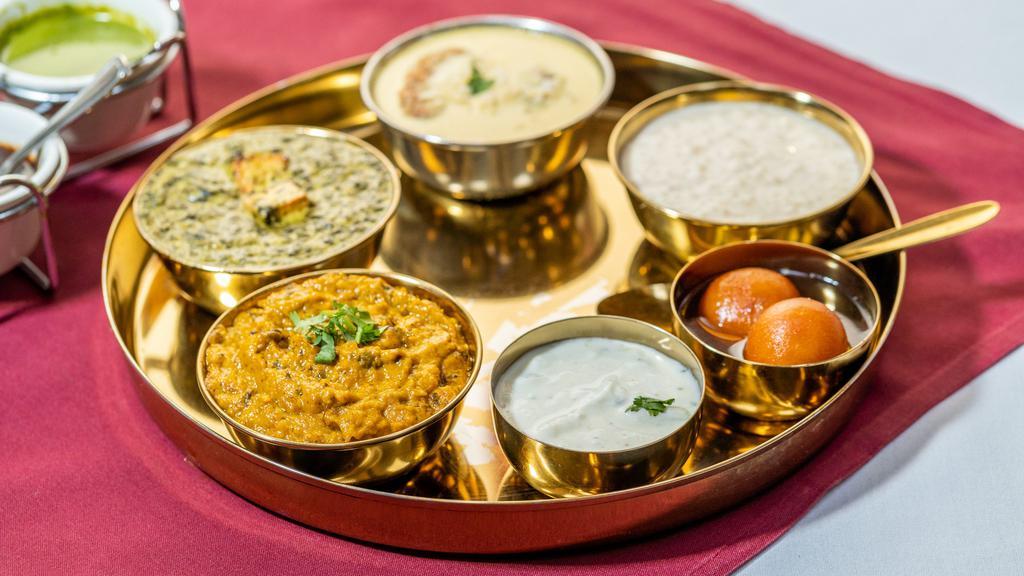 Thali · Thali is an Indian-style meal made up of a selection of various dishes which are served on a platter.