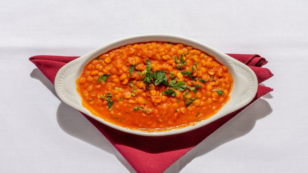 Tarka Dal · Lentils flavored with garlic and herbs.