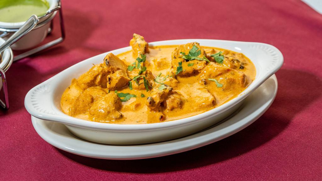 Chicken Tikka Masala · Tender boneless chicken pieces broiled in tandoor, then cooked in a tomato, onion and garlic sauce.