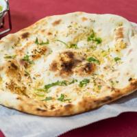 Garlic Naan · Light bread made with fresh garlic, herbs and cilantro.