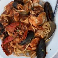 Seafood Linguini · Shrimp, lobster, mussels, calamari clams, lightly spiced tomato sauce.