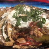 Alambre · Sautéed bell peppers, onions bacon your choice of meat topped off with mozzarella and Oaxaca...