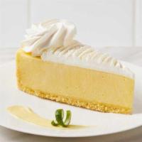 Key Lime Pie Cheesecake · Tart creamy cheesecake made with real key limes, topped with whipped cream on a crunchy vani...