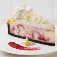 White Chocolate Raspberry Cheesecake · Classic cheesecake swirled with raspberry and chunks of white chocolate baked on a chocolate...