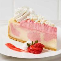 Wild Strawberries & Cream Cheesecake · Classic cheesecake and wild strawberry cheesecake swirled together on a vanilla crumb, toppe...