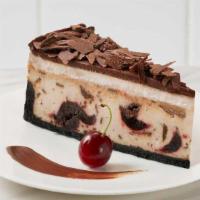 Chocolate Cherry Cheesecake · Cherry cheesecake swirled with Bordeaux cherries and dark chocolate chunks, topped with whit...