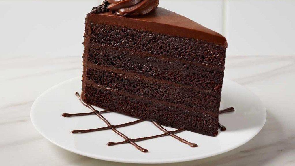 Fudge Cake · Moist fudge cake with chewy chocolate fudge icing, and chocolate fudge icing, and chocolate crunch on the sides.