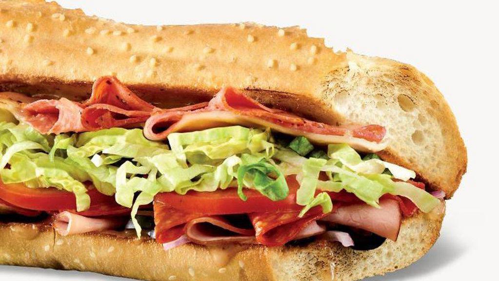 Classic Italian Sub · Capicola, salami, ham, pepperoni, provolone, hot banana peppers, shredded lettuce, tomato, red onions, olives, banana peppers, and red wine vinaigrette.